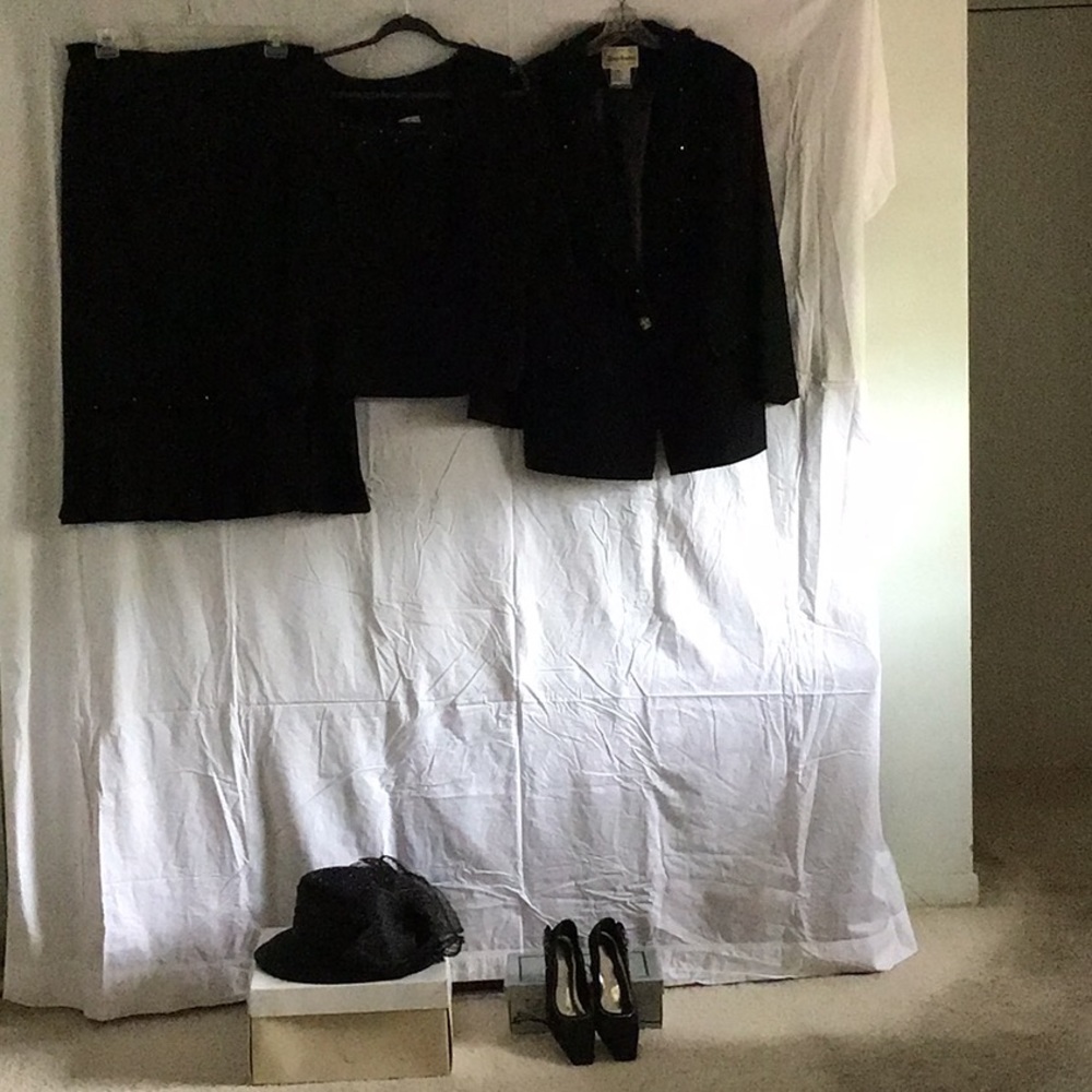 Three piece ladies skit and jacket with camisole.